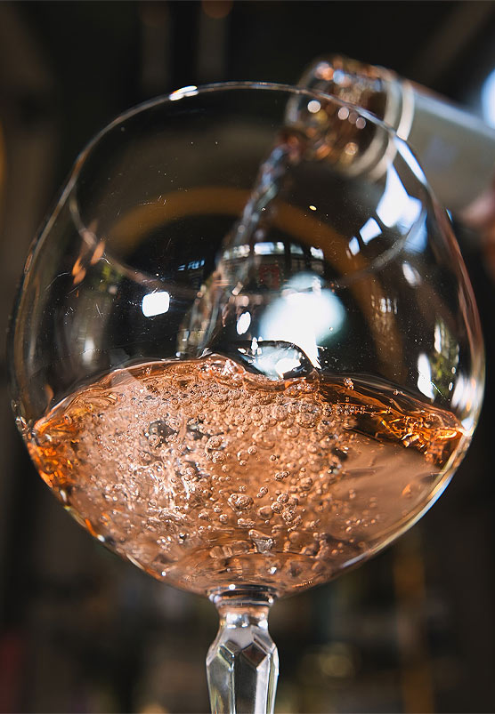 Pouring a Glass of Sparkling Rosé | Helena Modern Riviera